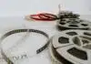 four reel films lying on white table