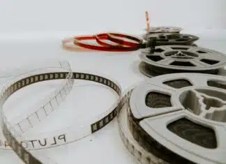 four reel films lying on white table