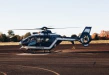 a helicopter sitting on top of an airport tarmac
