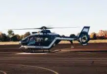 a helicopter sitting on top of an airport tarmac