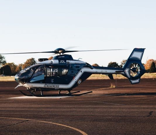 a helicopter sitting on top of an airport tarmac
